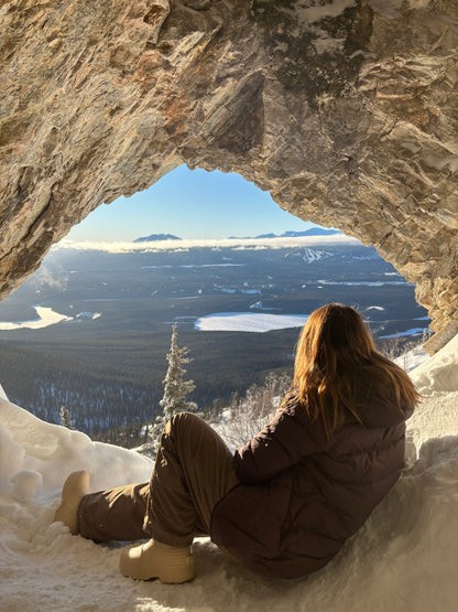 a girl in a cave wich is a hiking gems in Whitehorse, Yukon